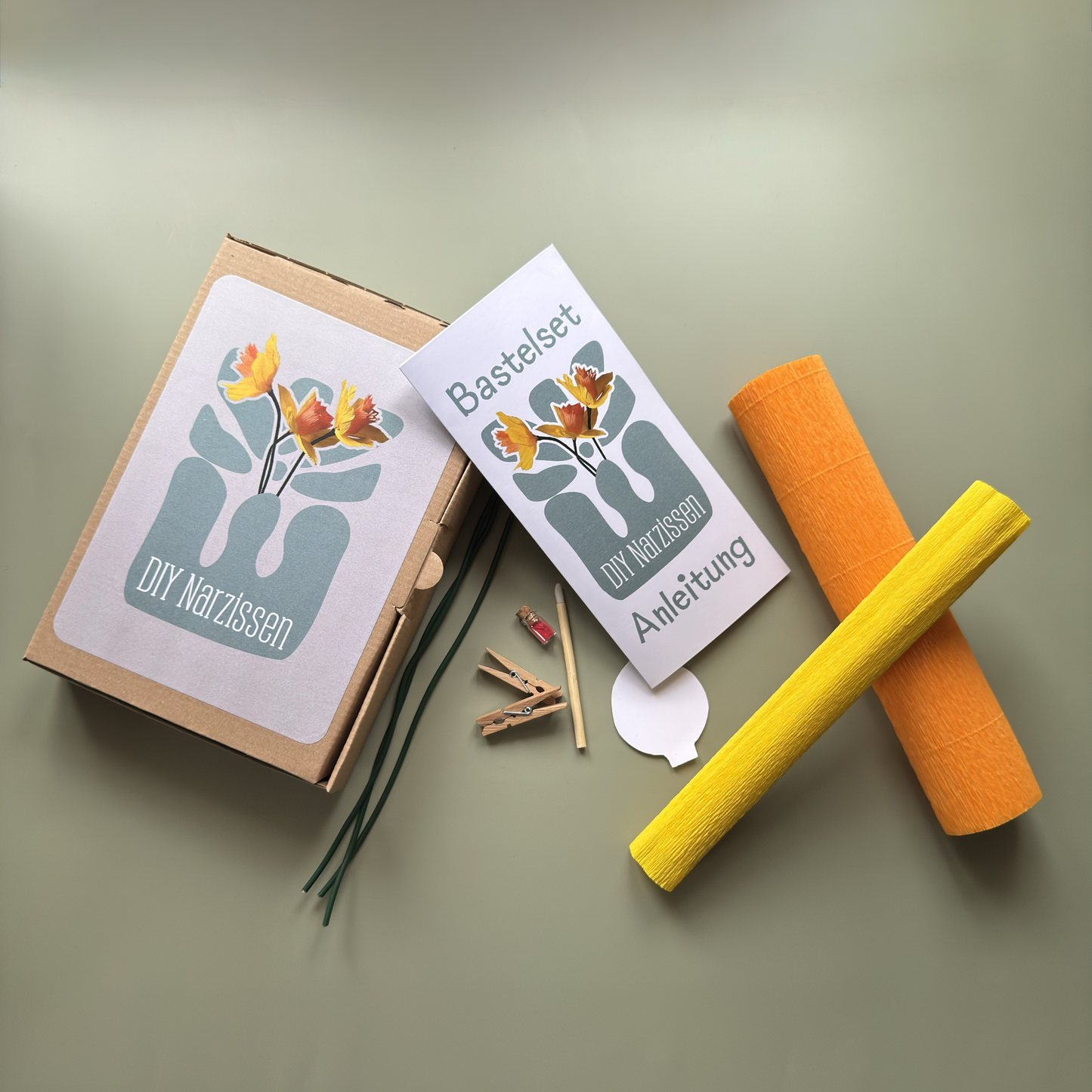 Inhalt des DIY Bastelsets Narzisse von Woodwormis World – Krepppapier, Floristendraht, Pastellkreide und Anleitung